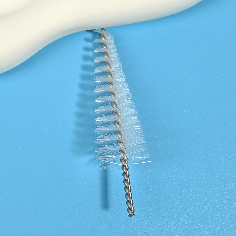 Medical device cleaning brush head with durable nylon bristles and twisted stainless steel wire, designed for effective cleaning of lumens, tubes, and narrow channels for B2B medical and OEM applications.