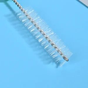 Medical device cleaning brush with stainless steel twisted wire and nylon bristles, featuring an ergonomic green handle for precise cleaning of tubes and medical instruments, suitable for B2B wholesale supply.
