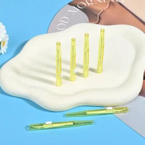 Push-pull type interdental brushes with yellow transparent handles, compact sliding design for easy storage and hygiene, suitable for dental care brands and B2B wholesale supply.