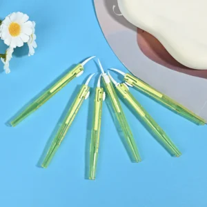 Push-pull type interdental brushes with yellow transparent handles, compact sliding design for easy storage and hygiene, suitable for dental care brands and B2B wholesale supply.