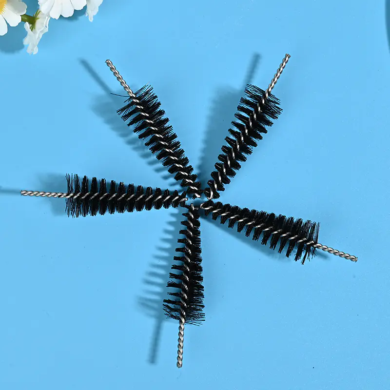 Medical device cleaning brush heads with black nylon bristles and stainless steel twisted wire core, designed for precise cleaning of medical instruments and narrow channels, B2B wholesale supply.