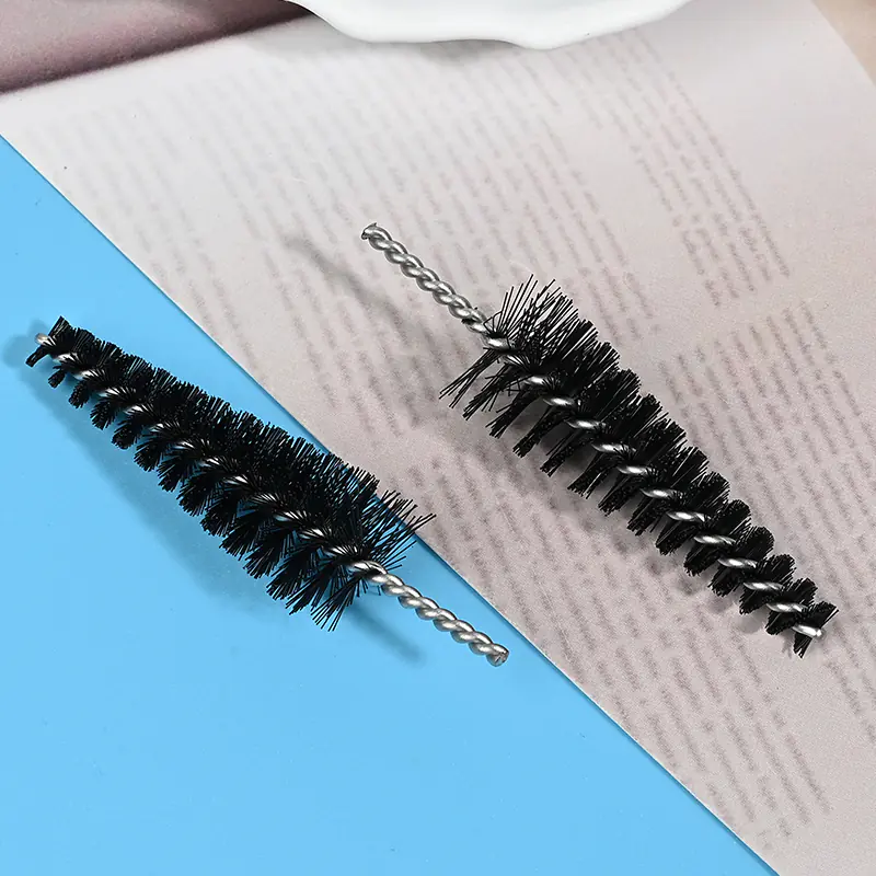 Medical device cleaning brush heads with black nylon bristles and stainless steel twisted wire core, designed for precise cleaning of medical instruments and narrow channels, B2B wholesale supply.