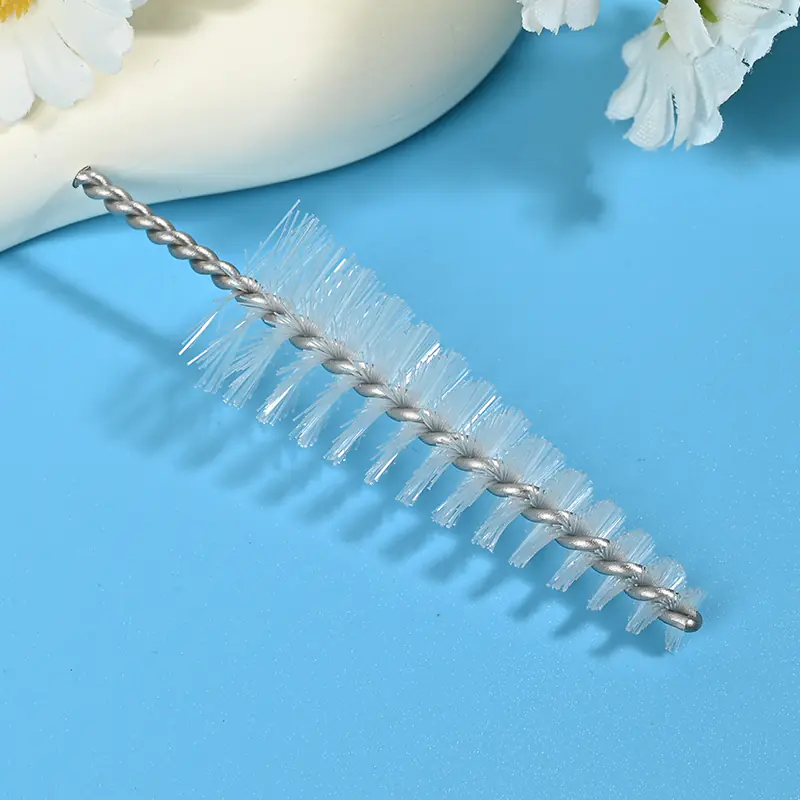 Medical device cleaning brush head with durable nylon bristles and twisted stainless steel wire, designed for effective cleaning of lumens, tubes, and narrow channels for B2B medical and OEM applications.
