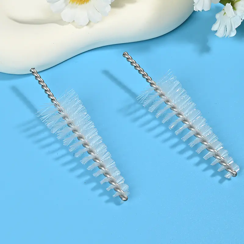 Medical device cleaning brush head with durable nylon bristles and twisted stainless steel wire, designed for effective cleaning of lumens, tubes, and narrow channels for B2B medical and OEM applications.