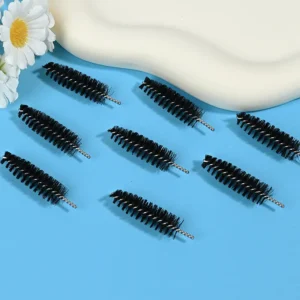 Black mascara brush heads with dense spiral bristles and twisted metal wire core, designed for professional eyelash application, OEM manufacturing, and bulk B2B cosmetic supply.