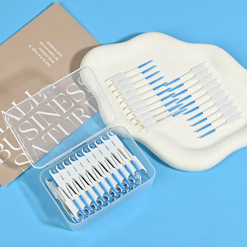 open clear box of blue silicone interdental brushes with loose samples