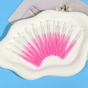 Disposable pink interdental brushes with protective caps - bulk pack for clinics, dental practices, and oral care distributors