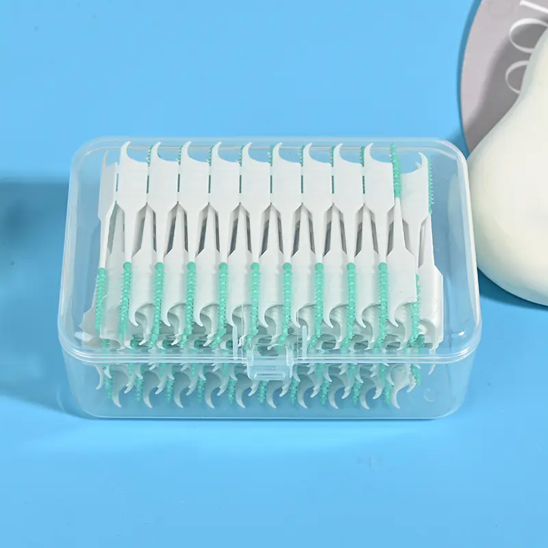 green silicone interdental brushes in closed clear storage box for wholesale dental care