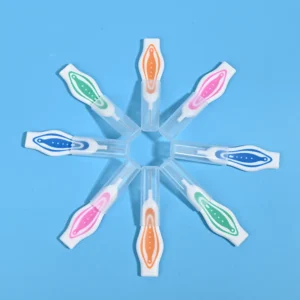 Colorful curved handle interdental brushes arranged radially, portable teeth gap cleaners with transparent protective cover