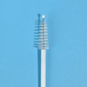 Macro close-up of safety rounded protective tip and nylon bristle head for cervical sampling brush, lab tube and medical pipeline cleaning brush, twisted metal wire structure